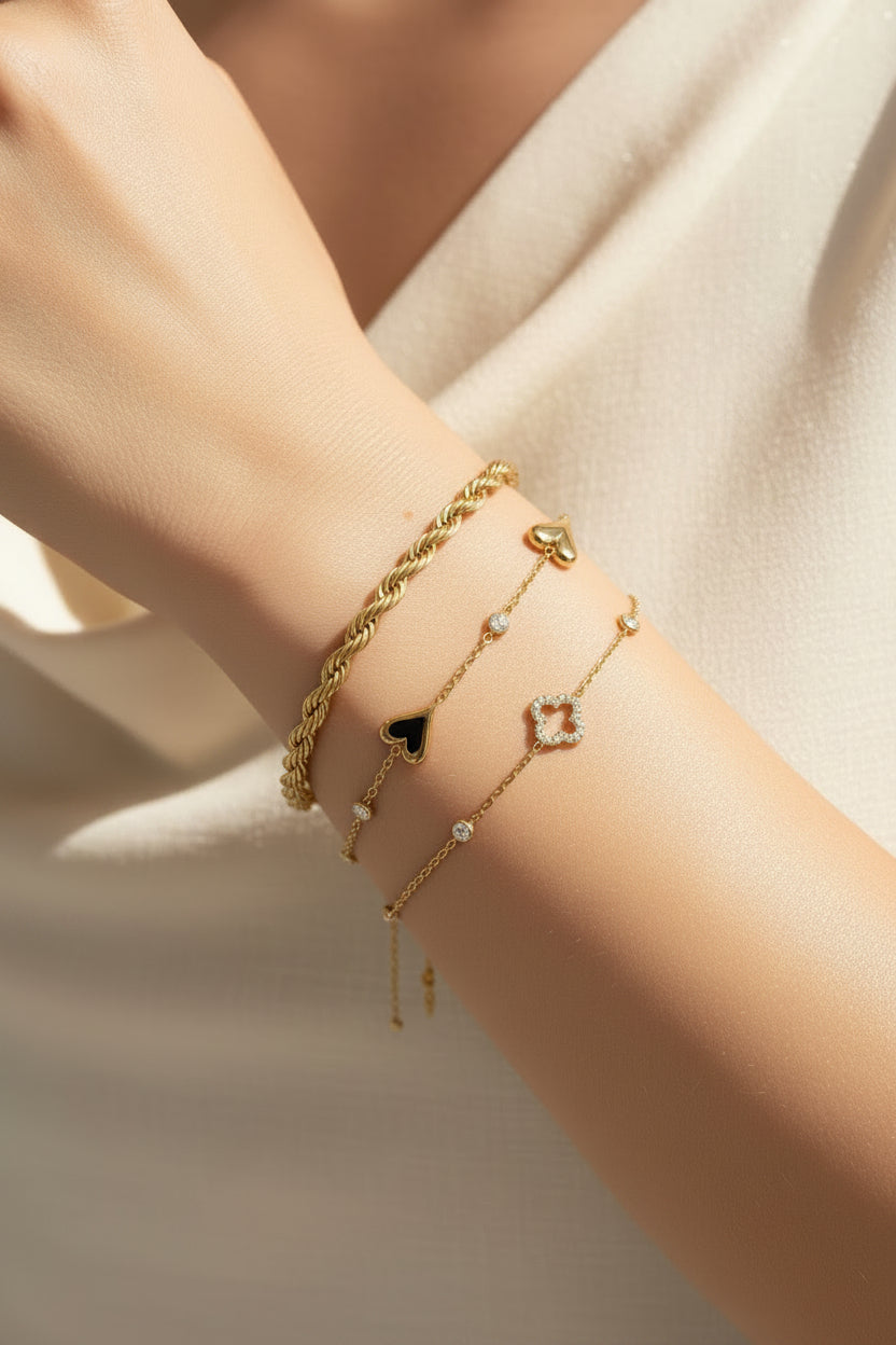 Bracelet with openwork and inlaid clovers and stones