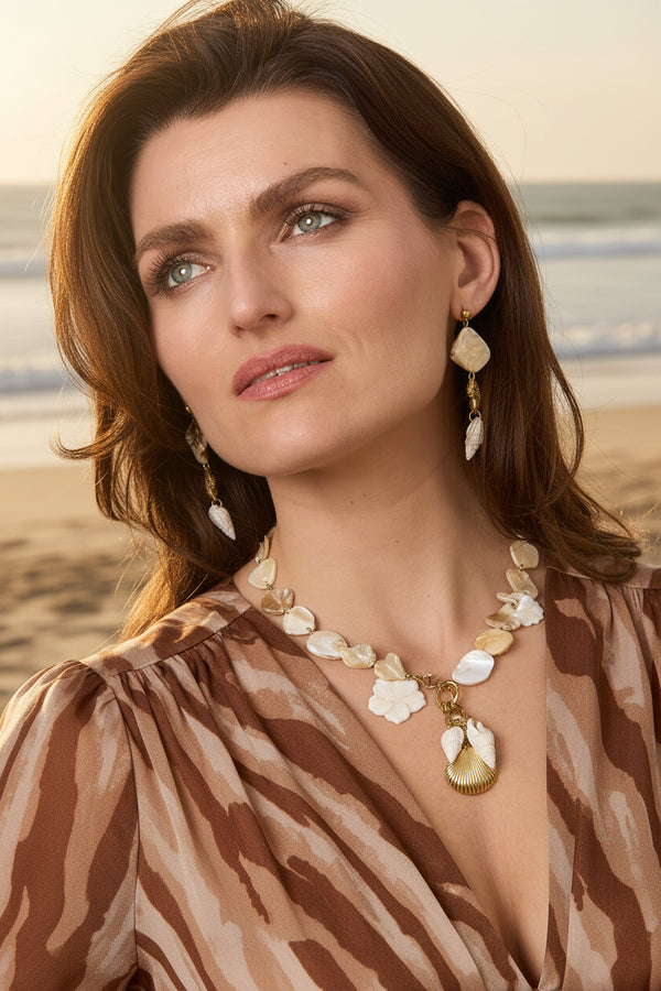 Necklace with beads of seashells, pearls and dangling shells