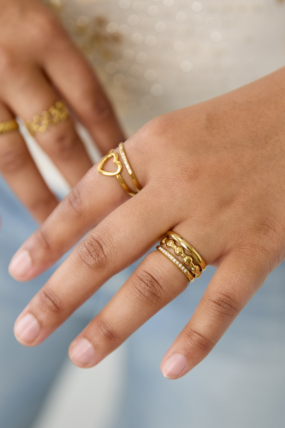 3-layer ring with round details and stones