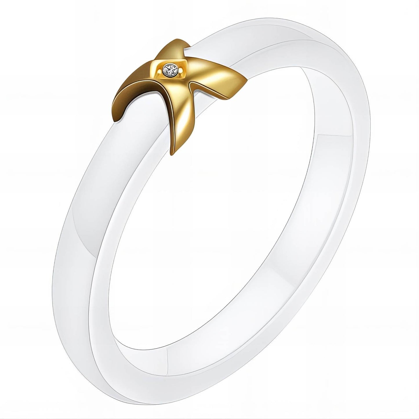 A white ceramic finger ring with a gold plated steel band and a gold-plated steel tip.