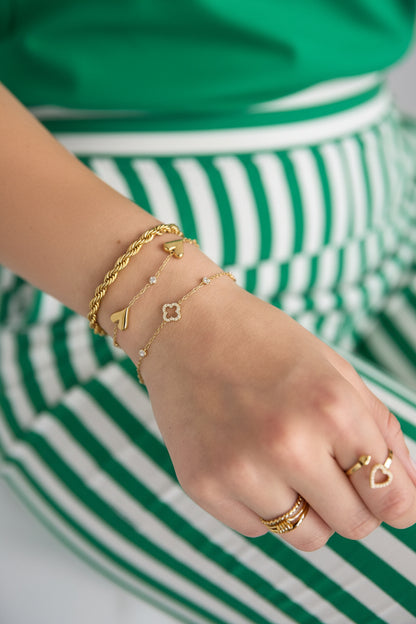Bracelet with openwork and inlaid clovers and stones