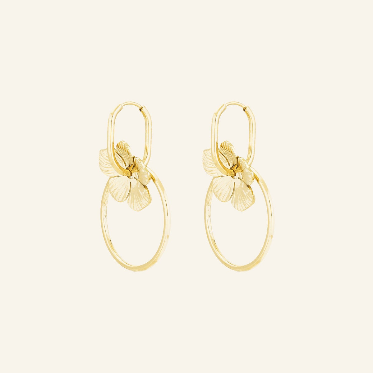 Double Anneau Drops in gold, linked double hoops with a sculpted flower