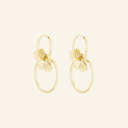 Double Anneau Drops in gold, linked double hoops with a sculpted flower