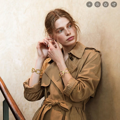 Goutte Open Bangle in gold worn on the wrist