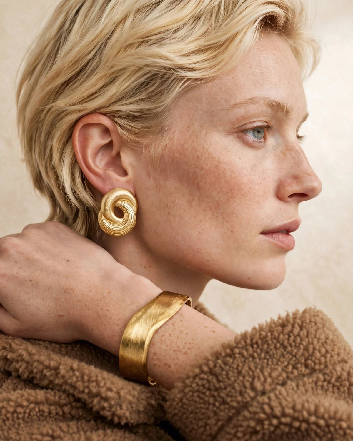 Infinity Twist earrings worn with the Contour sculpted cuff