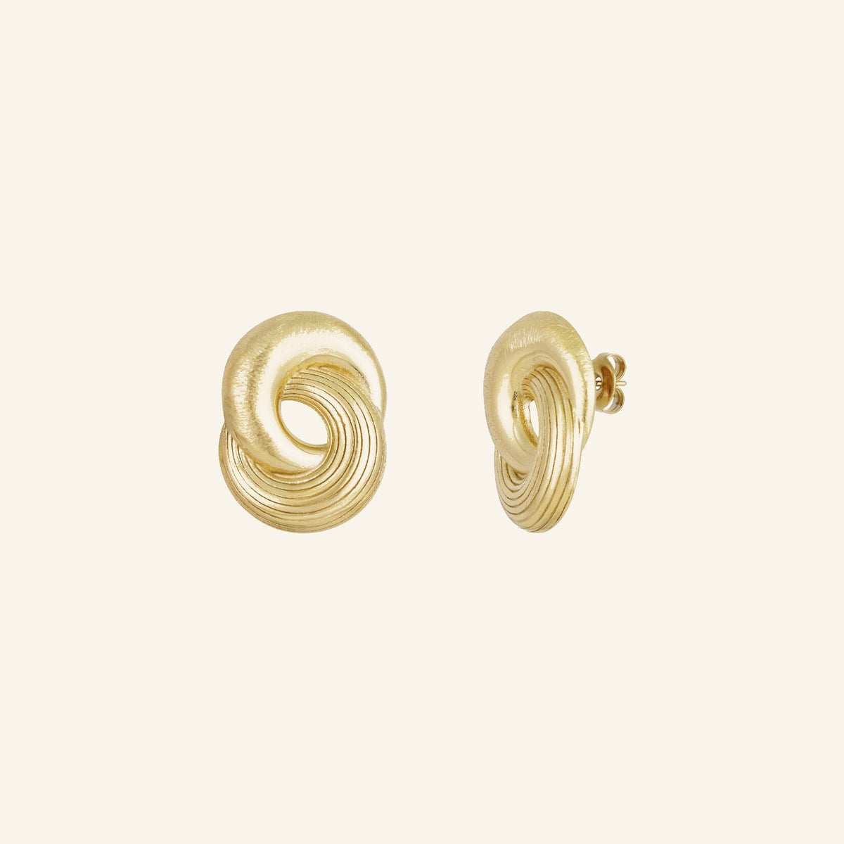 Infinity Twist Earrings, a coiled sculptural stud in gold