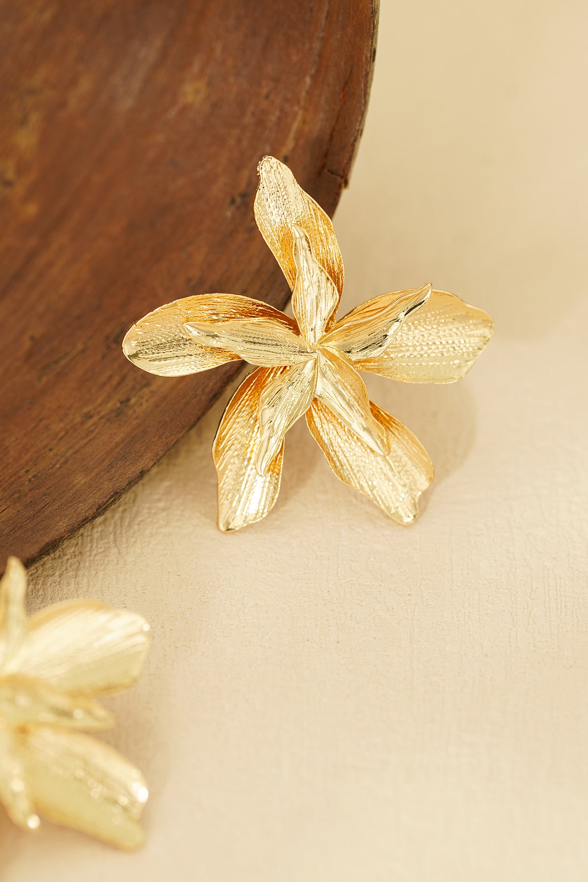 Gold-tone sculptural orchid flower statement earrings