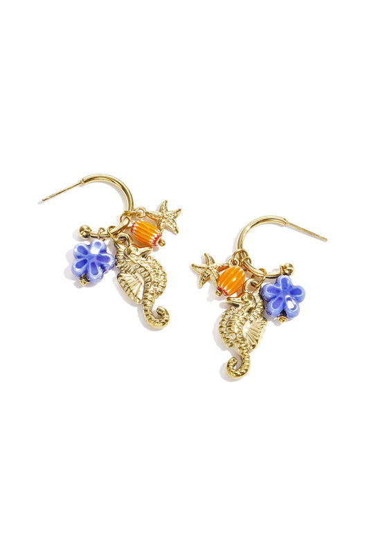 Gold-tone seahorse earrings with charms and enamel detail