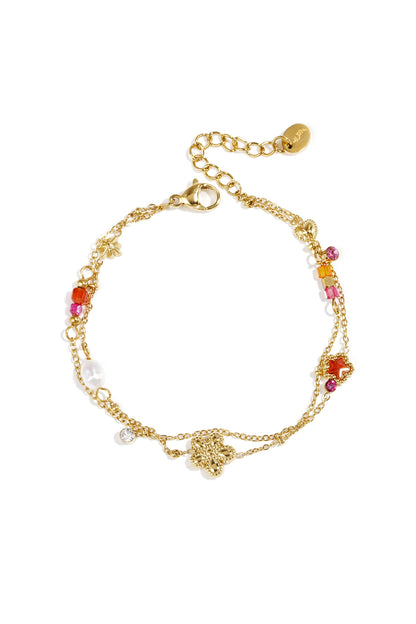 Charm bracelet with star and flower charms, pearls, stones and beads