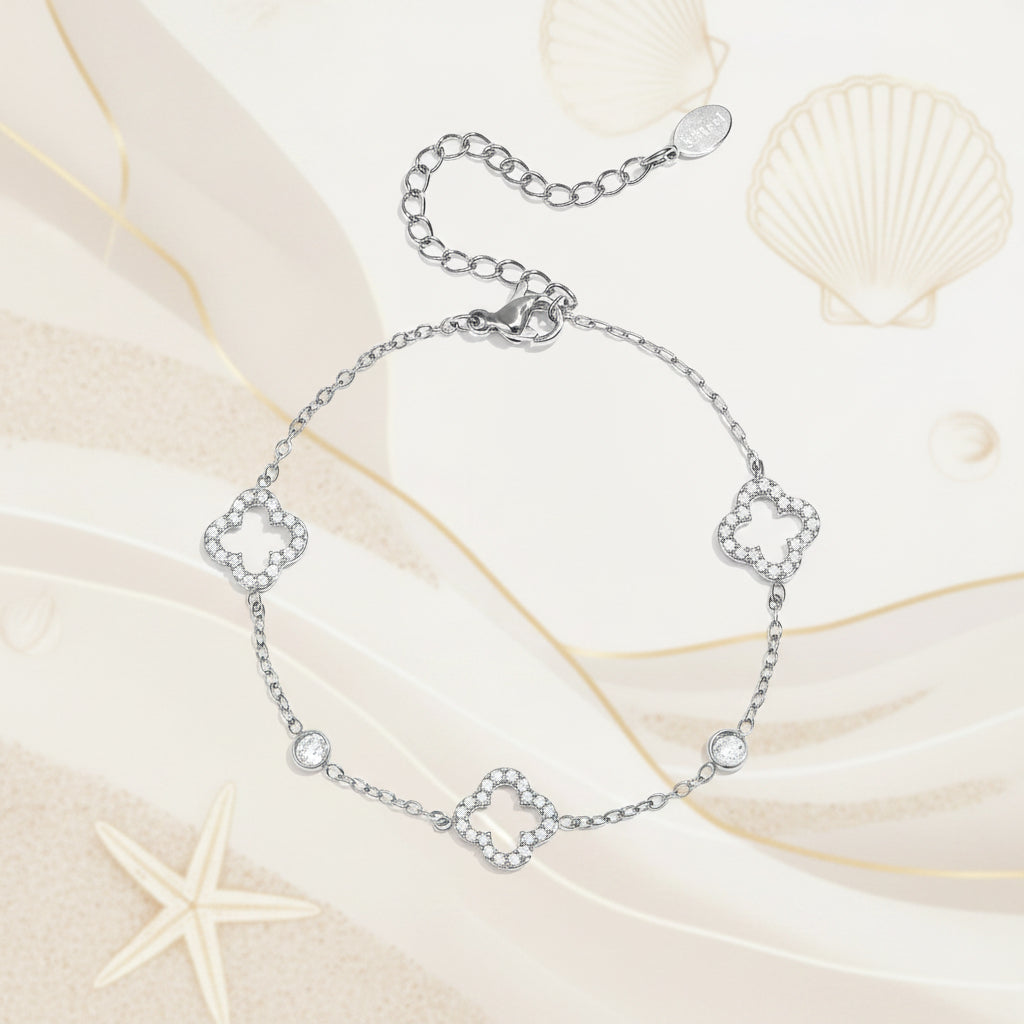 Bracelet with openwork and inlaid clovers and stones