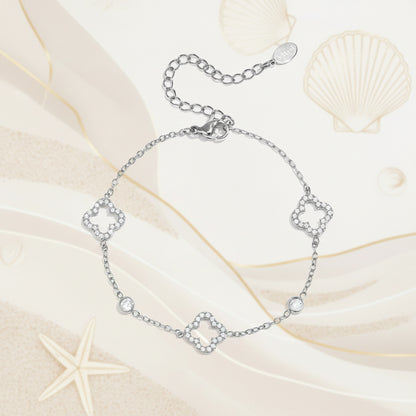 Bracelet with openwork and inlaid clovers and stones