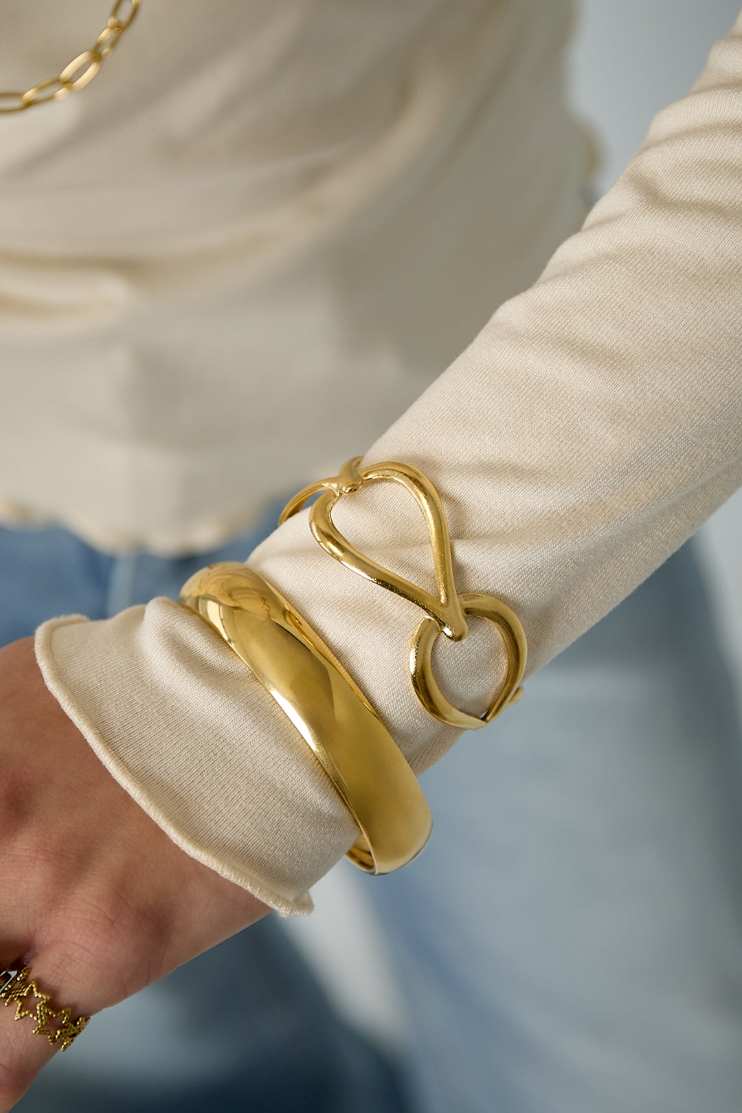 Goutte Open Bangle worn stacked with other Veneris bracelets